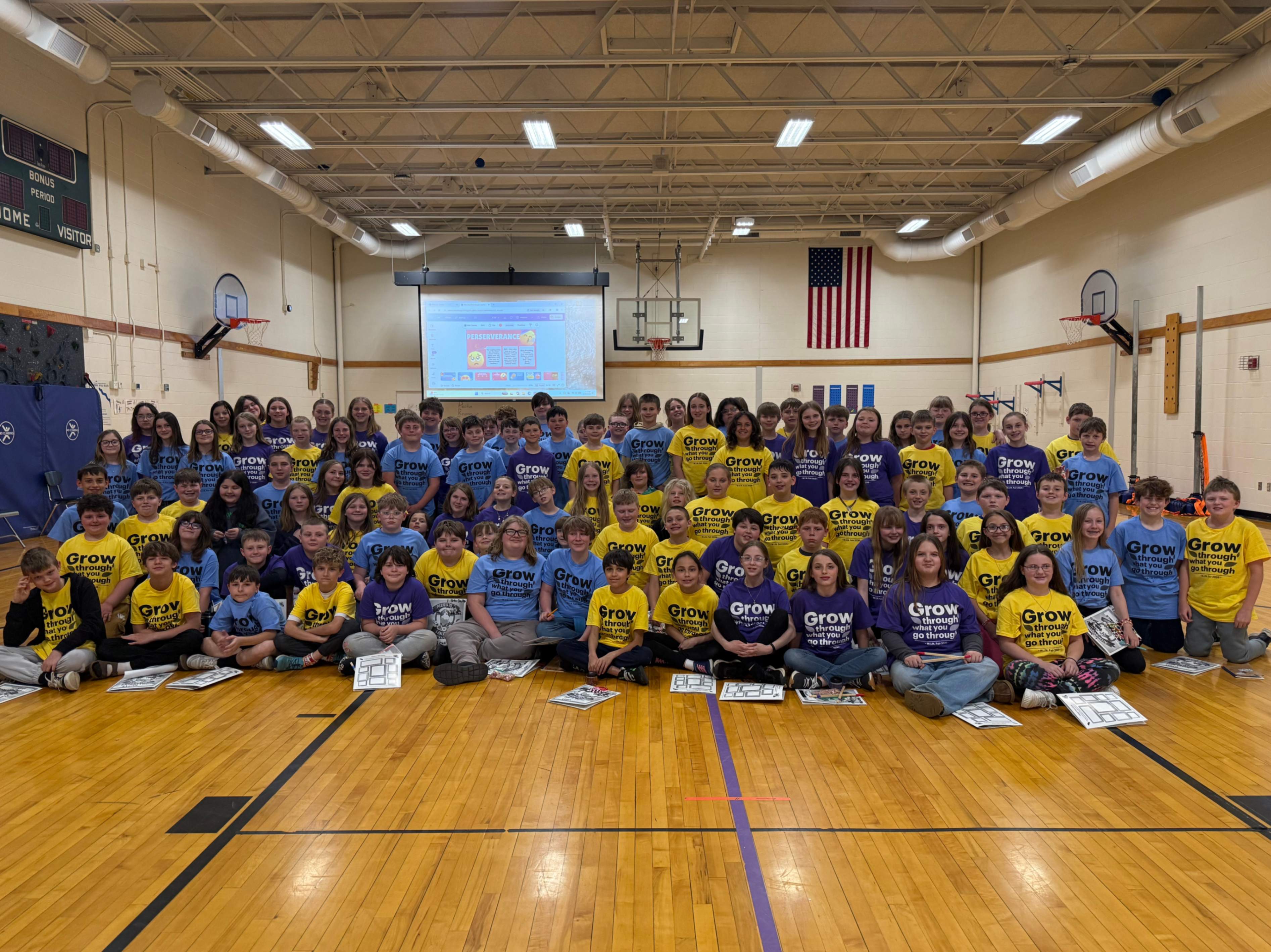 The fifth grade class poses for a group photo in the Hickory Grove gym during their recent WIN fair.